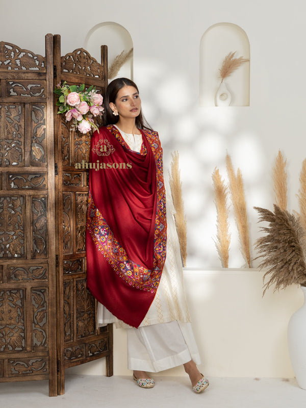 Red Handloom Pure Pashmina Shawl accented by refined Gulaabdaar Embroidery